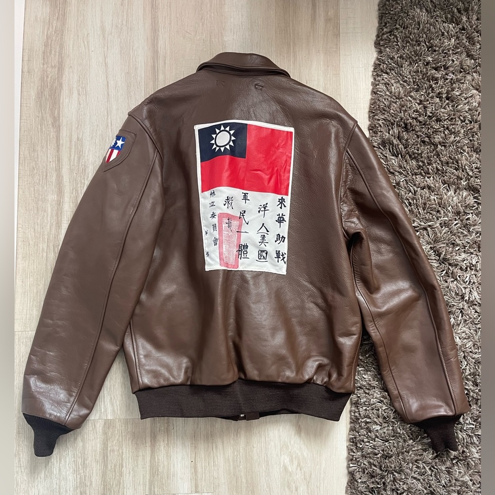 Vintage-Inspired Brown Leather Bomber Jacket with Patch Accents - Picture 2 of 10